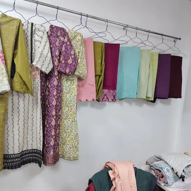 Colourful suits hanging in the shop