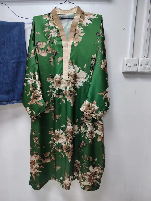 Gold embroidered ladies' suit stitched at the shop