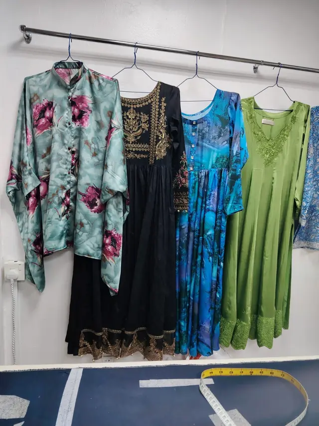 Rail of finished ladies' suits in every colour
