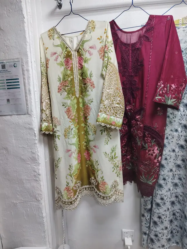 Embroidered ladies' suits stitched at the shop